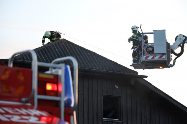Three firefighters in a major fire at a car workshop in Satellite