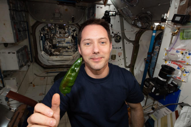 Thomas Basket poses with chili from the International Space Station on October 29, 2021.